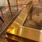 Gina - Table basse en verre et métal doré
